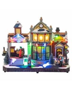Stazione di Babbo Natale - Villaggio Natalizio con Luci LED, Movimento e Musica 30 cm